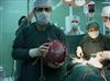تصویر خروج توده 9 كيلويی از شكم بيمار قمی 